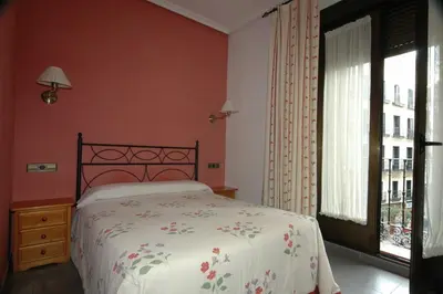 Cama o camas de una habitación en Hostal Ivor