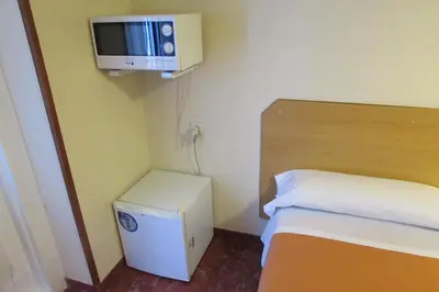 Cama o camas de una habitación en Hostal Prim