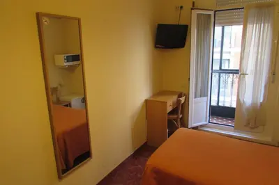 Cama o camas de una habitación en Hostal Prim