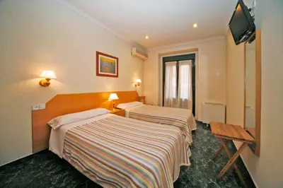 Cama o camas de una habitación en Hostal Prim