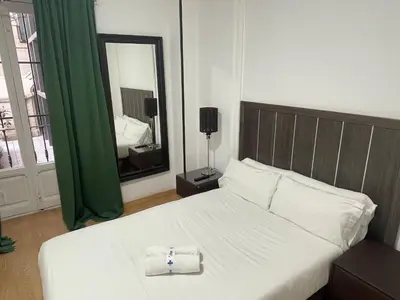Cama o camas de una habitación en Apartamentos Day Madrid GRAN VIA II
