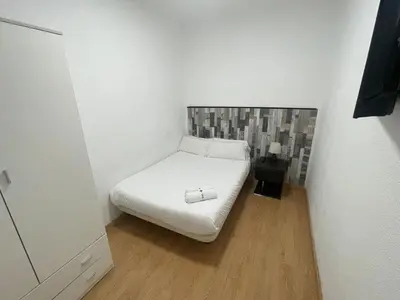 Cama o camas de una habitación en Apartamentos Day Madrid GRAN VIA II