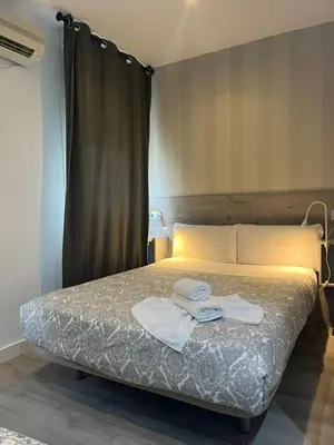 Cama o camas de una habitación en Hostal Abril Madrid