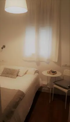 Cama o camas de una habitación en Hostal Santa Isabel