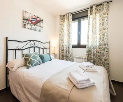 Cama o camas de una habitación en Apavonia Apartamento 2 Dormitorios Distrito Latina Madrid