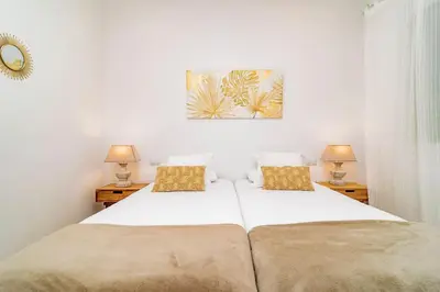 Cama o camas de una habitación en Juan Bravo Suites