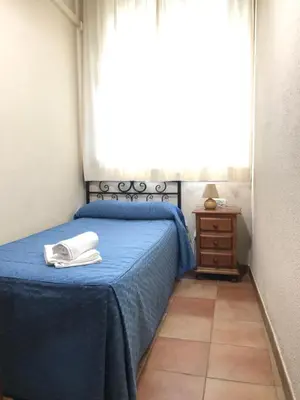 Cama o camas de una habitación en Hostal El Pilar
