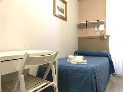 Cama o camas de una habitación en Hostal El Pilar