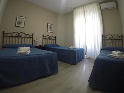 Cama o camas de una habitación en Hostal El Pilar
