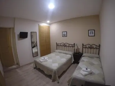 Cama o camas de una habitación en Hostal El Pilar