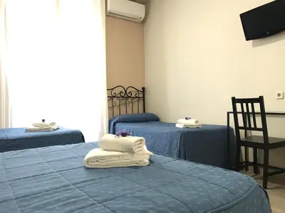 Cama o camas de una habitación en Hostal El Pilar