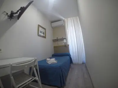 Cama o camas de una habitación en Hostal El Pilar