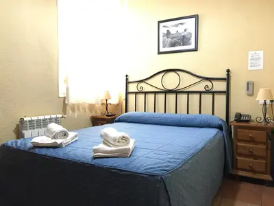 Cama o camas de una habitación en Hostal El Pilar