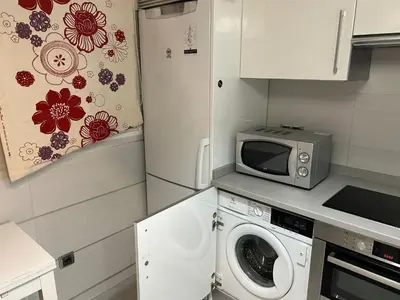 Una cocina o zona de cocina en Una genial estancia en Madrid centro