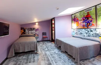 Cama o camas de una habitación en JC Rooms Chueca