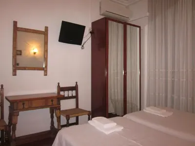 Cama o camas de una habitación en Hostal Esmeralda