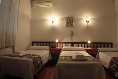 Cama o camas de una habitación en Hostal Esmeralda