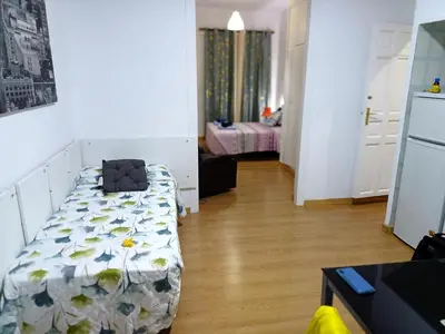 Cama o camas de una habitación en Estudio Grande Madrid Centro