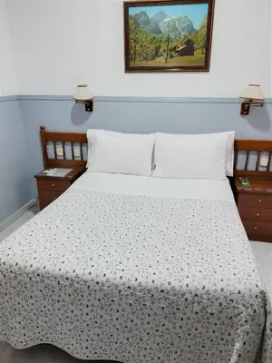 Cama o camas de una habitación en Hostal Dulcinea
