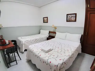 Cama o camas de una habitación en Hostal Dulcinea