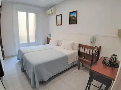 Cama o camas de una habitación en Hostal Dulcinea