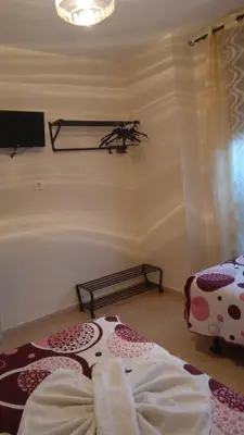 Cama o camas de una habitación en Hostal Huespedes Toledo