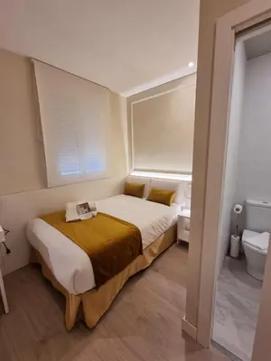 Cama o camas de una habitación en CH Velarde