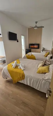 Cama o camas de una habitación en Habitaciones Universal