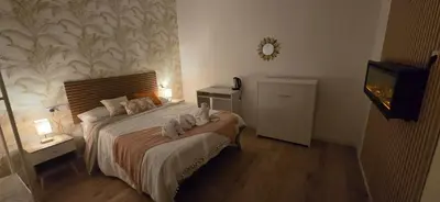 Cama o camas de una habitación en Habitaciones Universal