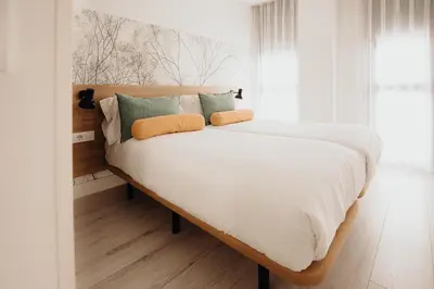 Cama o camas de una habitación en Aspasios Atocha Apartments