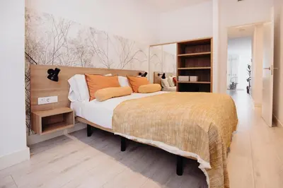 Cama o camas de una habitación en Aspasios Atocha Apartments