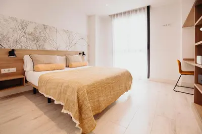 Cama o camas de una habitación en Aspasios Atocha Apartments