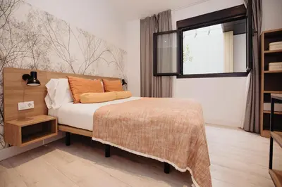 Cama o camas de una habitación en Aspasios Atocha Apartments