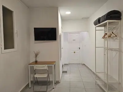 Una televisión o centro de entretenimiento en Casa Lemus