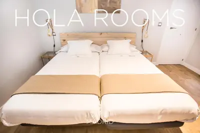 Cama o camas de una habitación en Hola Rooms