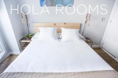 Cama o camas de una habitación en Hola Rooms