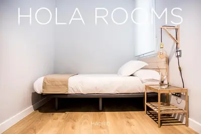 Cama o camas de una habitación en Hola Rooms