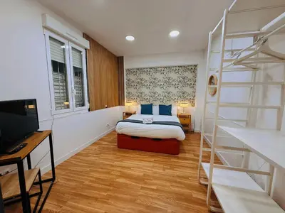 Cama o camas de una habitación en Hola Rooms