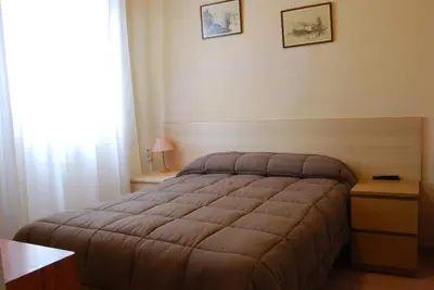 Cama o camas de una habitación en Hostal America