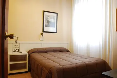 Cama o camas de una habitación en Hostal America