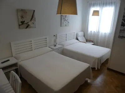 Cama o camas de una habitación en Hostal America