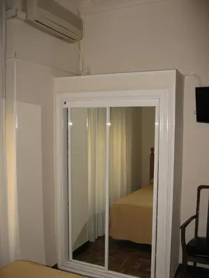 Cama o camas de una habitación en Hostal Maria Cristina