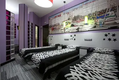 Cama o camas de una habitación en JC Rooms Santa Ana