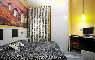Cama o camas de una habitación en JC Rooms Santa Ana