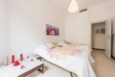 Cama o camas de una habitación en M&F Apartaments Gran Via