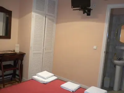 Cama o camas de una habitación en Hostal San Martin