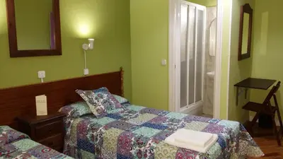 Cama o camas de una habitación en Hostal San Martin
