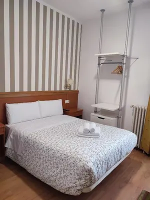 Cama o camas de una habitación en Hostal Salomé