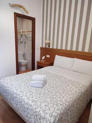 Cama o camas de una habitación en Hostal Salomé