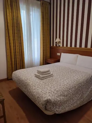 Cama o camas de una habitación en Hostal Salomé